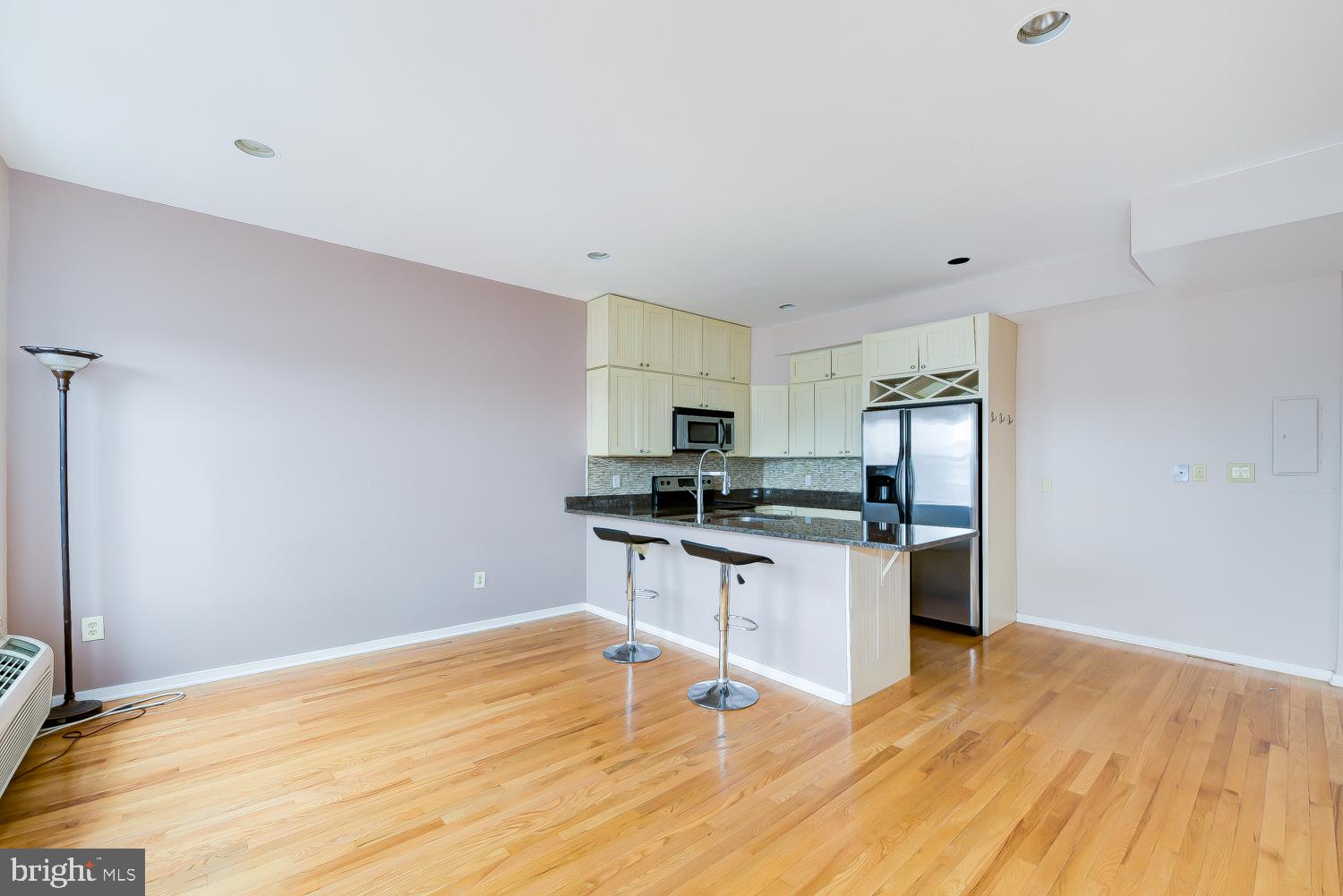 2300 18th Street Northwest, Unit 301 Washington, DC 20009 - Photo 9 of 20 a kitchen with stainless steel appliances a stove top oven a sink and a refrigerator