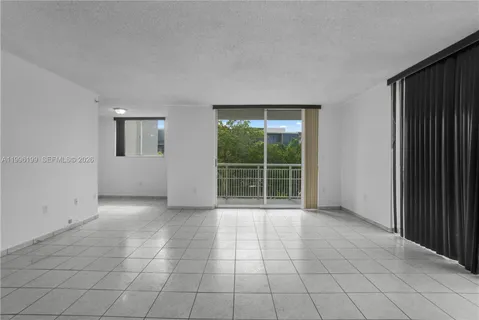 a kitchen with stainless steel appliances granite countertop a refrigerator stove and sink