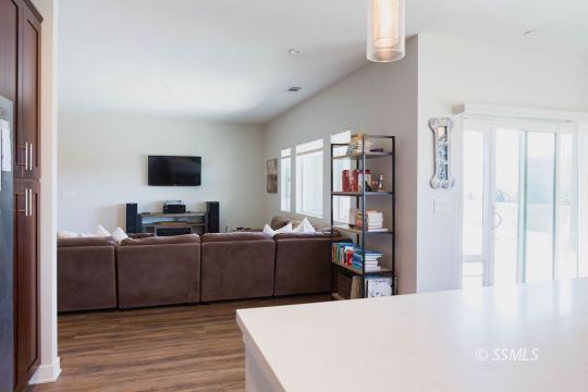411 Abigail Street Ridgecrest, CA 93555 - Photo 13 of 39 a living room with furniture and a flat screen tv