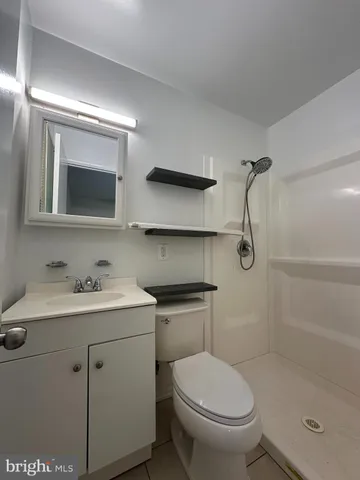 a balcony with wooden floor and trees