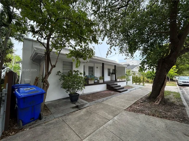 a view of a house with couches in a patio