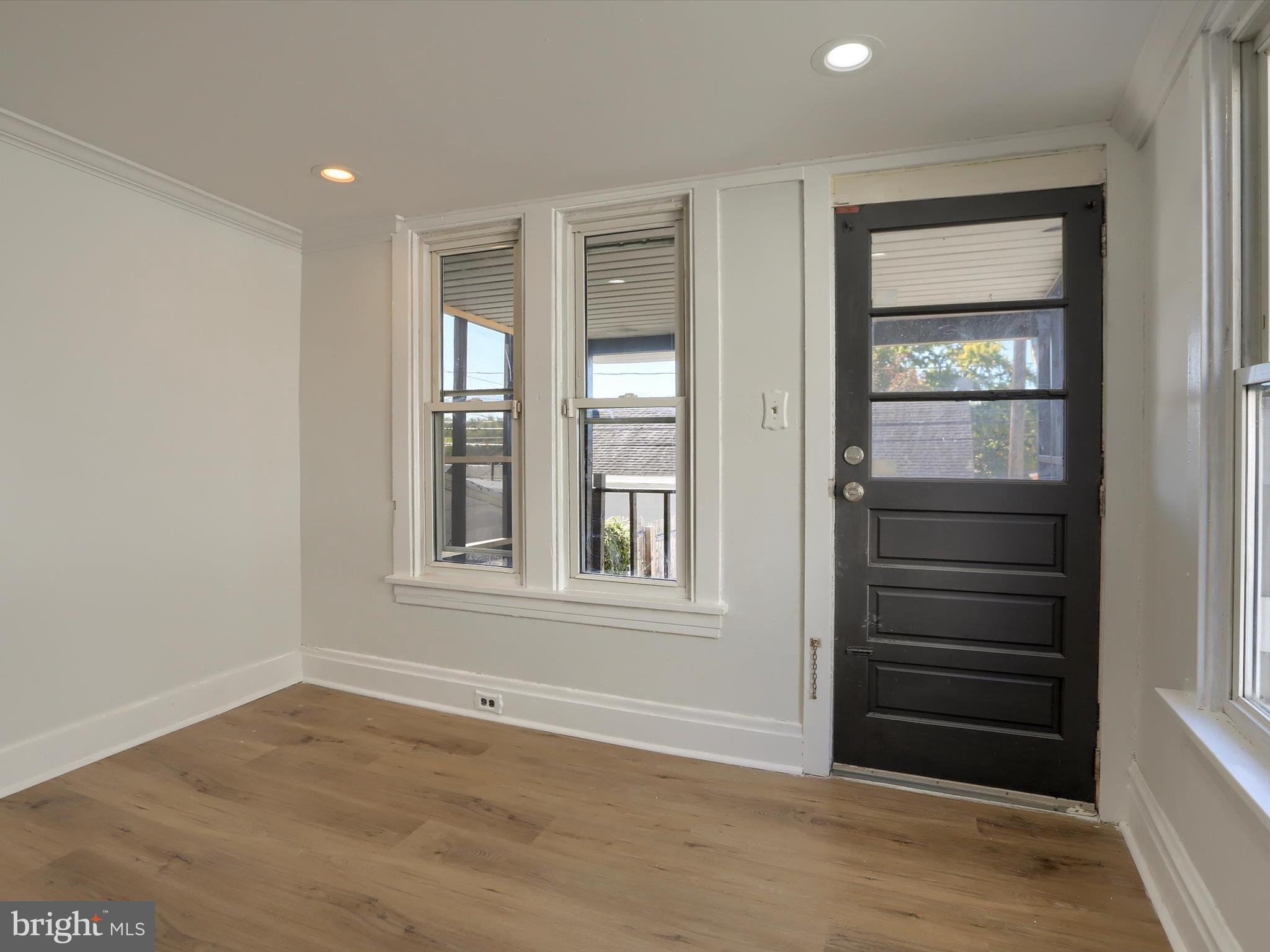 556 North 2nd Street Steelton, PA 17113 - Photo 13 of 33 wooden floor and window in an empty room