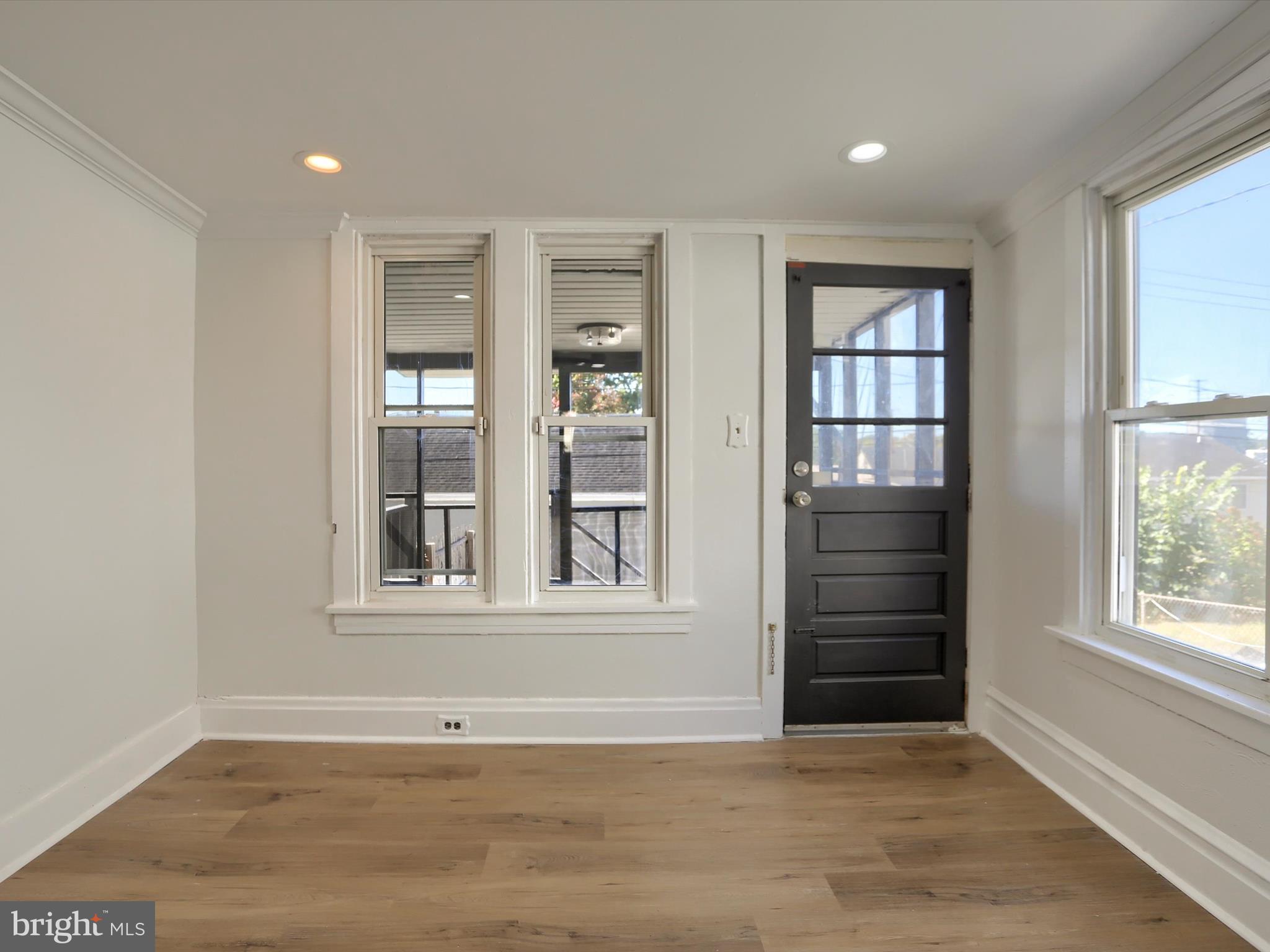 556 North 2nd Street Steelton, PA 17113 - Photo 14 of 33 an empty room with wooden floor and windows