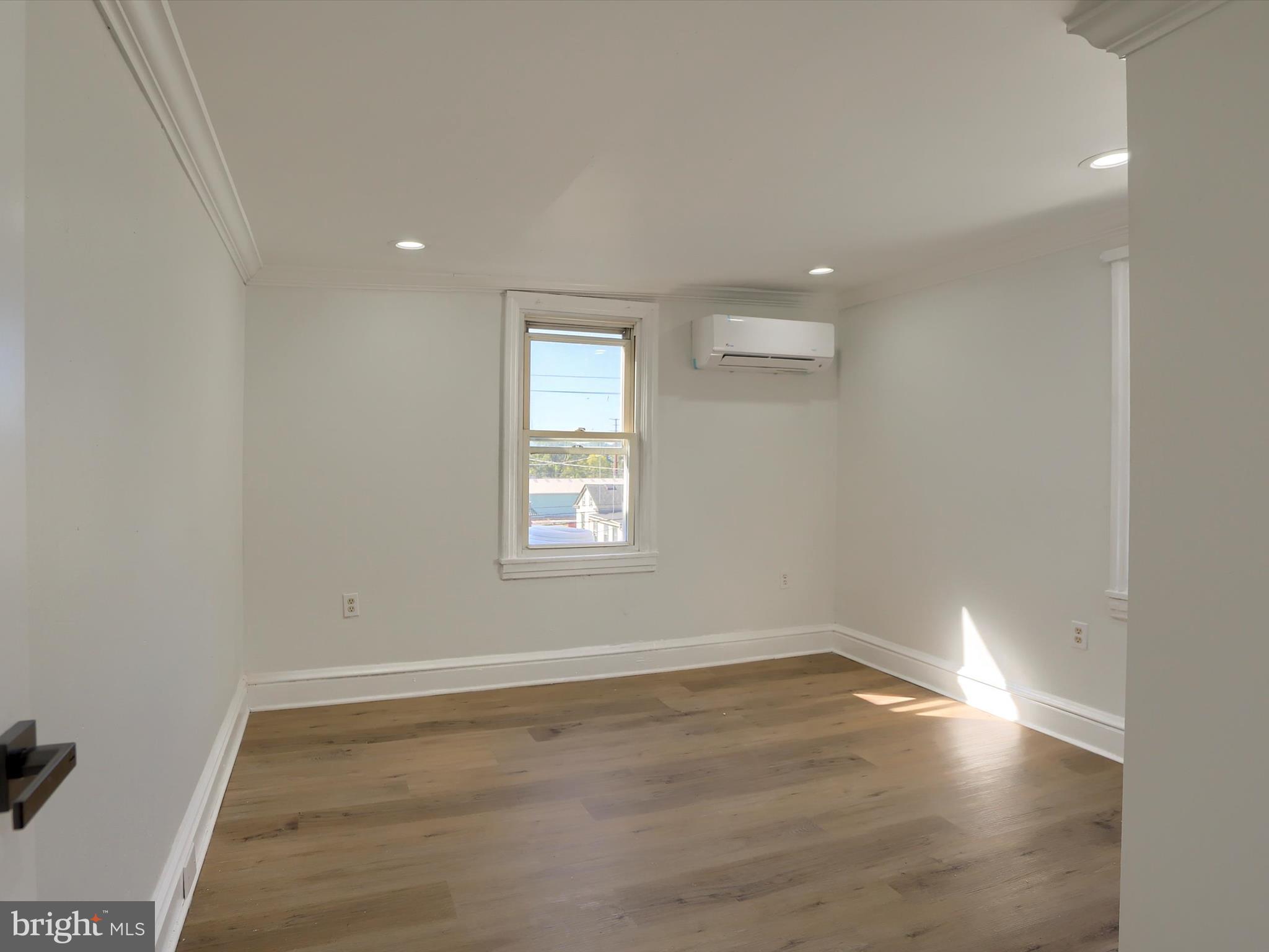 556 North 2nd Street Steelton, PA 17113 - Photo 17 of 33 wooden floor in an empty room with a window