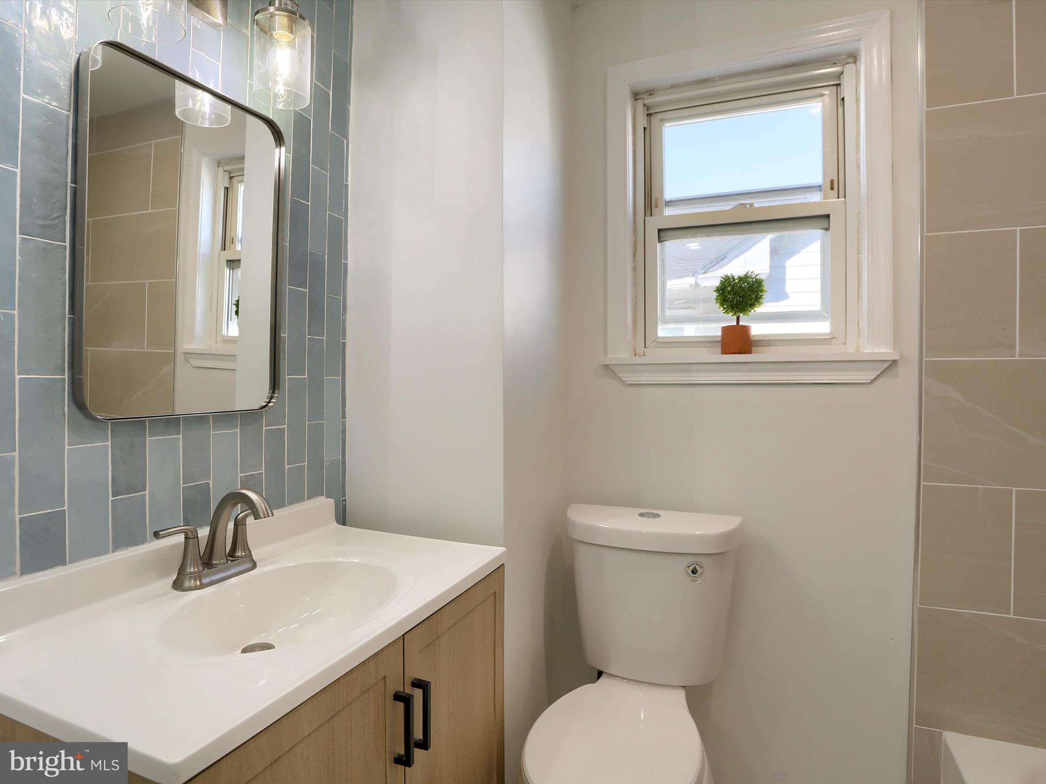 556 North 2nd Street Steelton, PA 17113 - Photo 21 of 33 a bathroom with a toilet sink and mirror