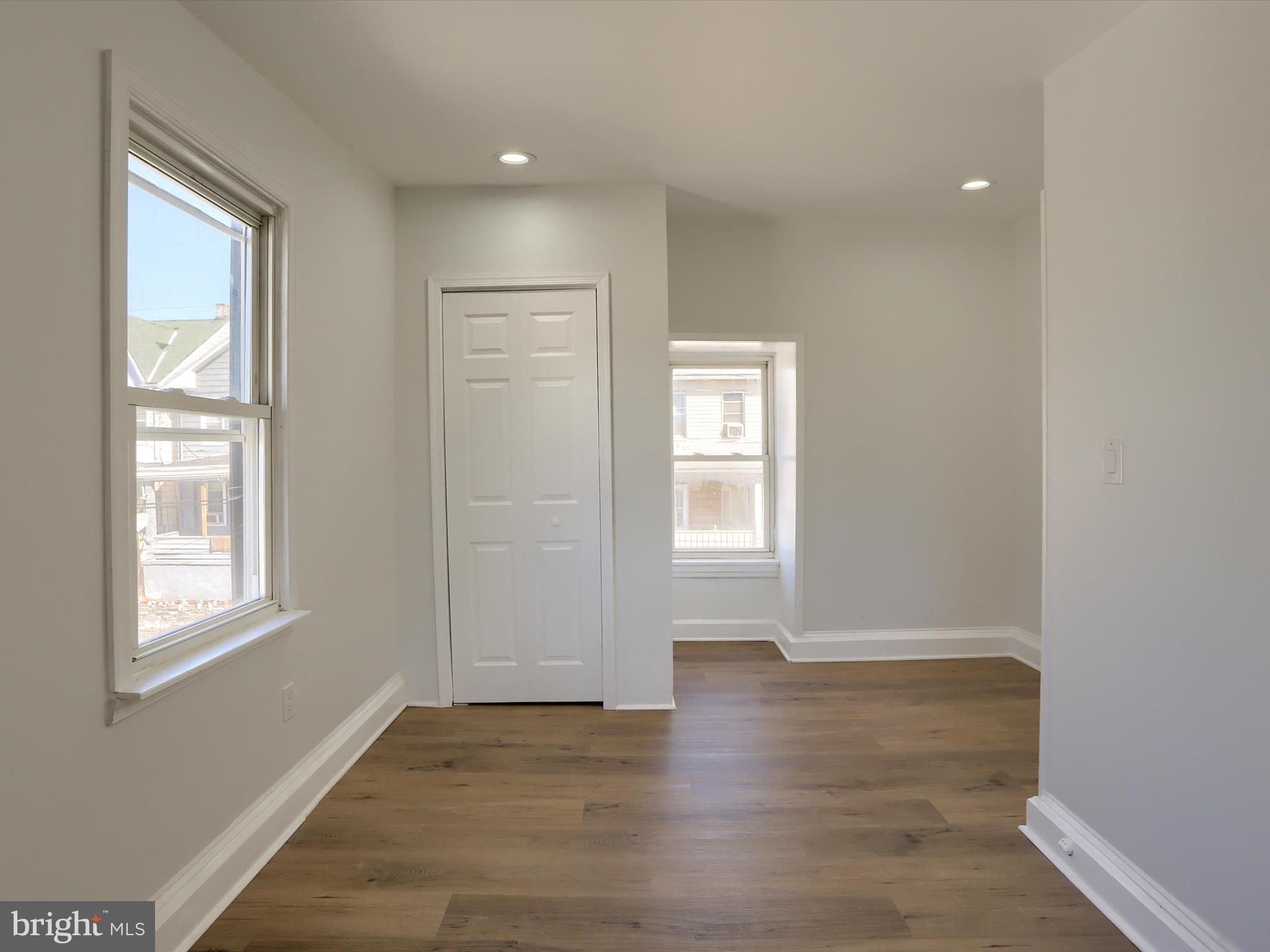 556 North 2nd Street Steelton, PA 17113 - Photo 28 of 33 a view of an empty room with wooden floor and a window