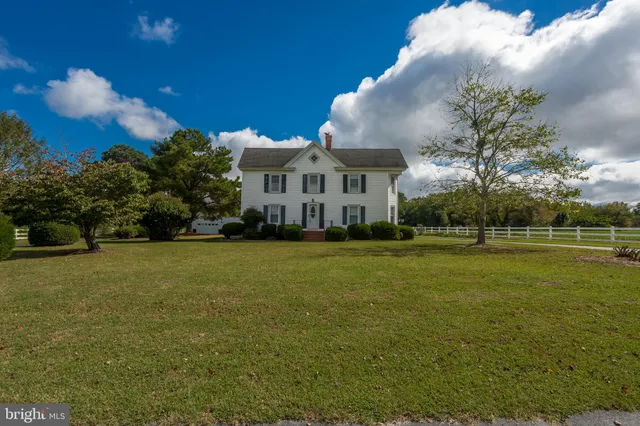 a view of a house with garden and yard