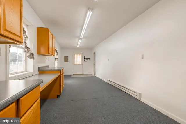 a view of empty room with windows