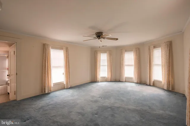 a view of an empty room and window