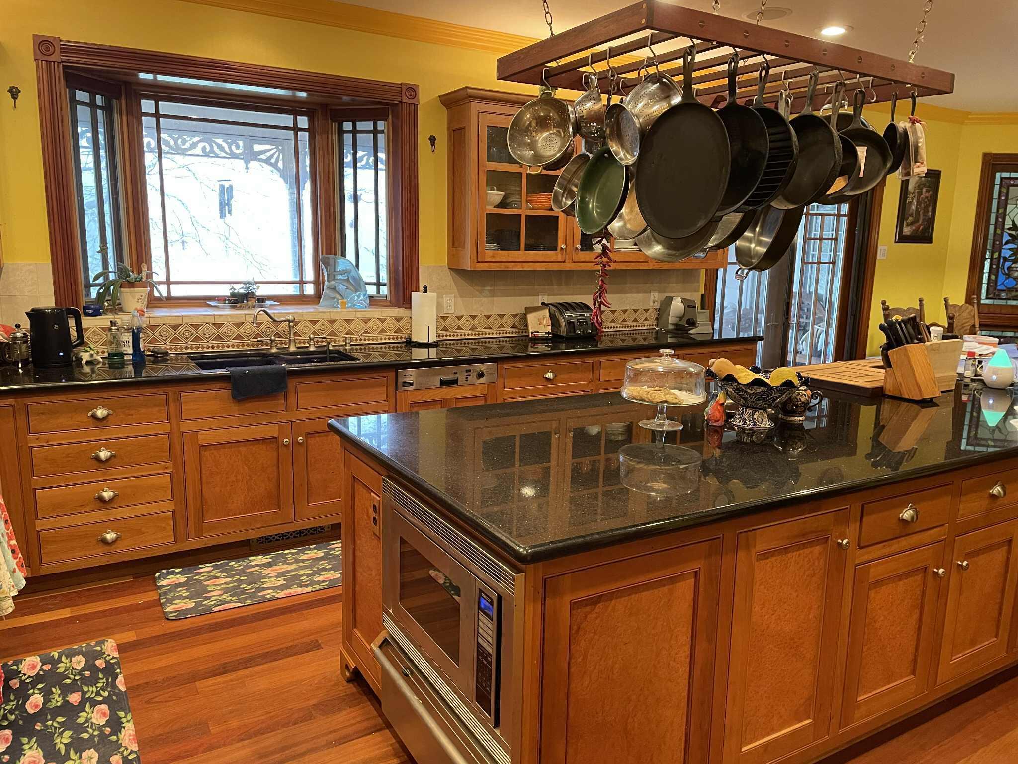 1100 McMullen Creek Road Selma, OR 97538 - Photo 21 of 25 a kitchen with wooden cabinets and a sink