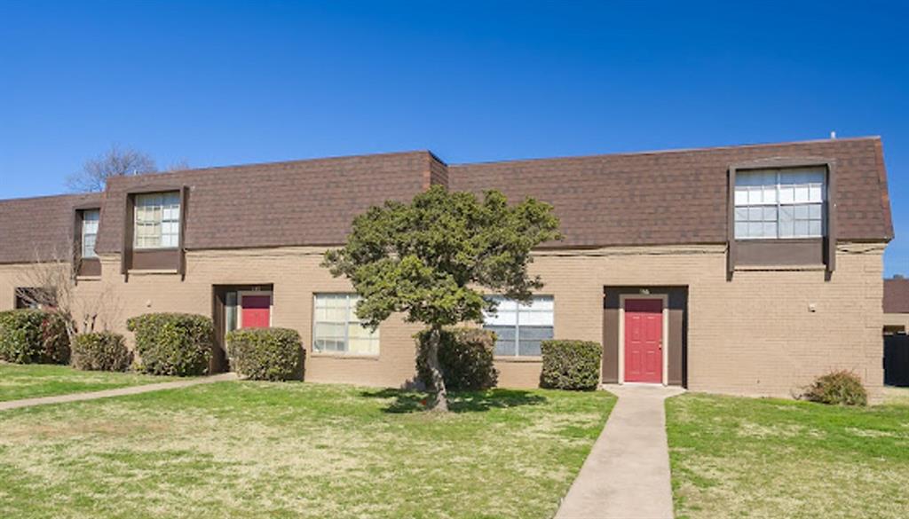 2400 Buffalo Gap Road, Unit 136 Abilene, TX 79605 - Photo 1 of 1 a front view of a house with a yard and garage