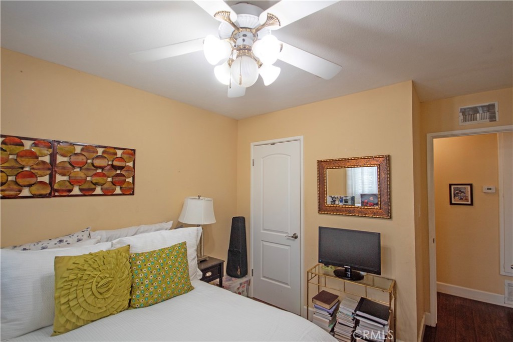 24230 Postmaster Avenue Harbor City, CA 90710 - Photo 11 of 31 a bedroom with a bed and a desk