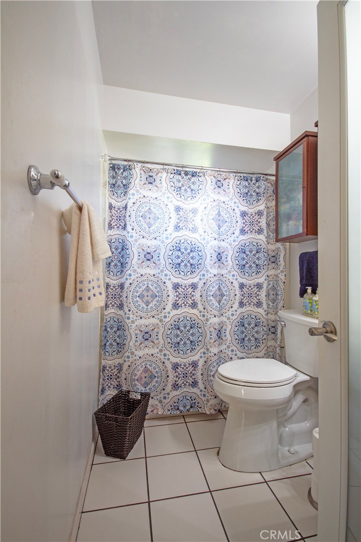 24230 Postmaster Avenue Harbor City, CA 90710 - Photo 15 of 31 a bathroom with a toilet and a shower