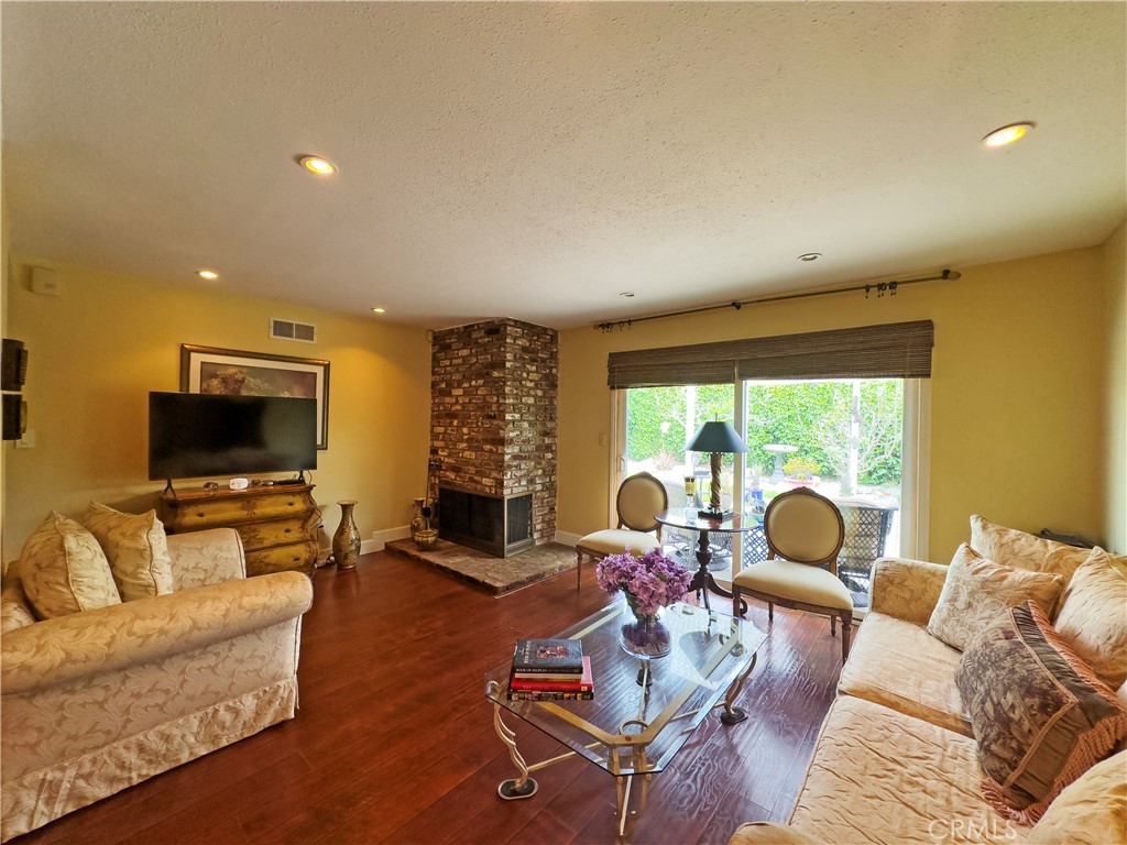 24230 Postmaster Avenue Harbor City, CA 90710 - Photo 20 of 31 a living room with furniture and a flat screen tv next to a large window
