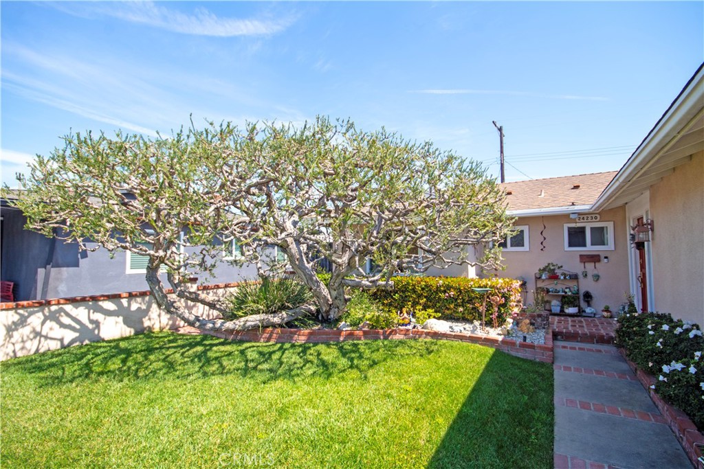 24230 Postmaster Avenue Harbor City, CA 90710 - Photo 2 of 31 a front view of a house with a yard