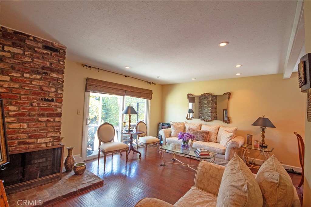 24230 Postmaster Avenue Harbor City, CA 90710 - Photo 21 of 31 a living room with furniture and a fireplace