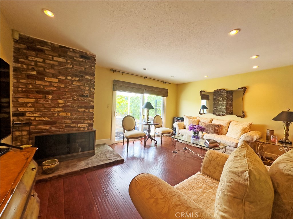 24230 Postmaster Avenue Harbor City, CA 90710 - Photo 22 of 31 a living room with furniture and a fireplace