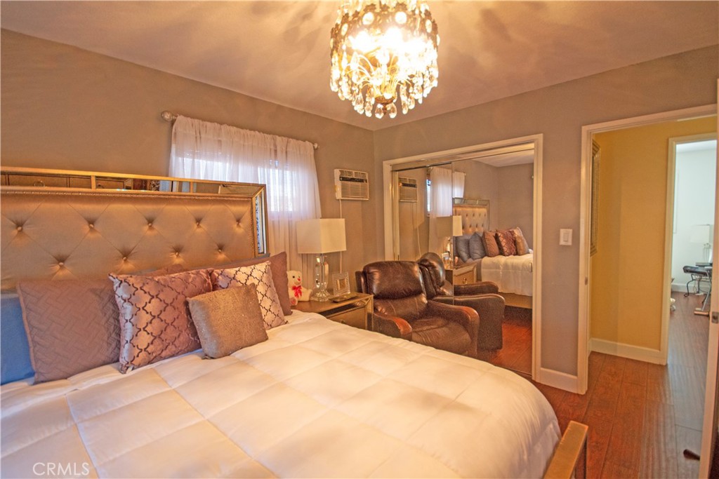 24230 Postmaster Avenue Harbor City, CA 90710 - Photo 7 of 31 a bedroom with bed and window