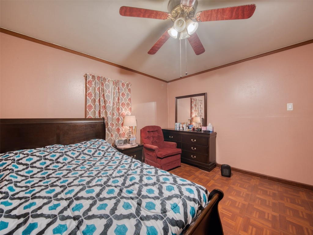 2900 Castro Street Austin, TX 78702 - Photo 25 of 39 a bedroom with a bed and wooden floor