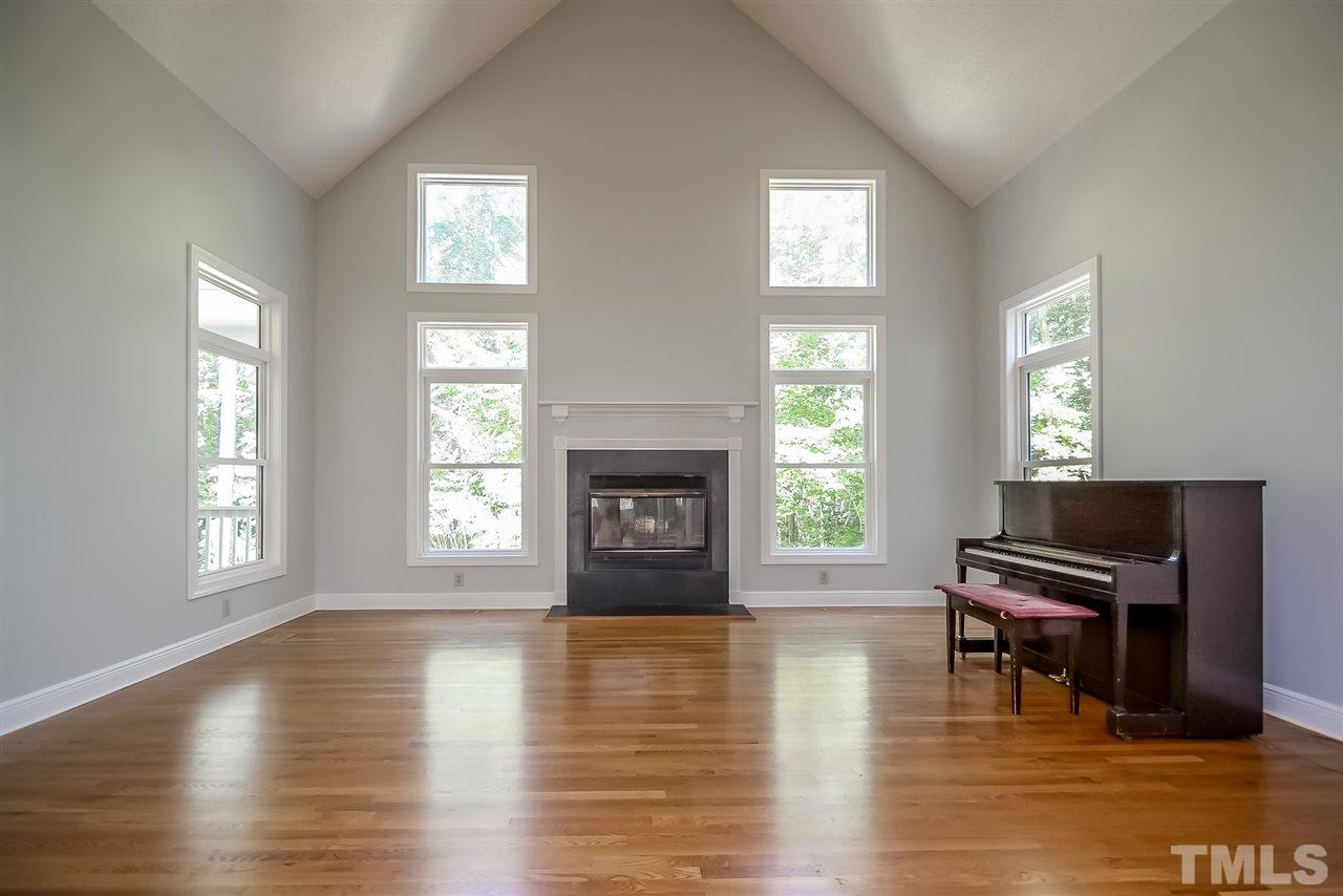 12925 Ghoston Road Wake Forest, NC 27587 - Photo 11 of 24 Soaring vaulted ceiling. Wood burning fireplace. Hardwoods.