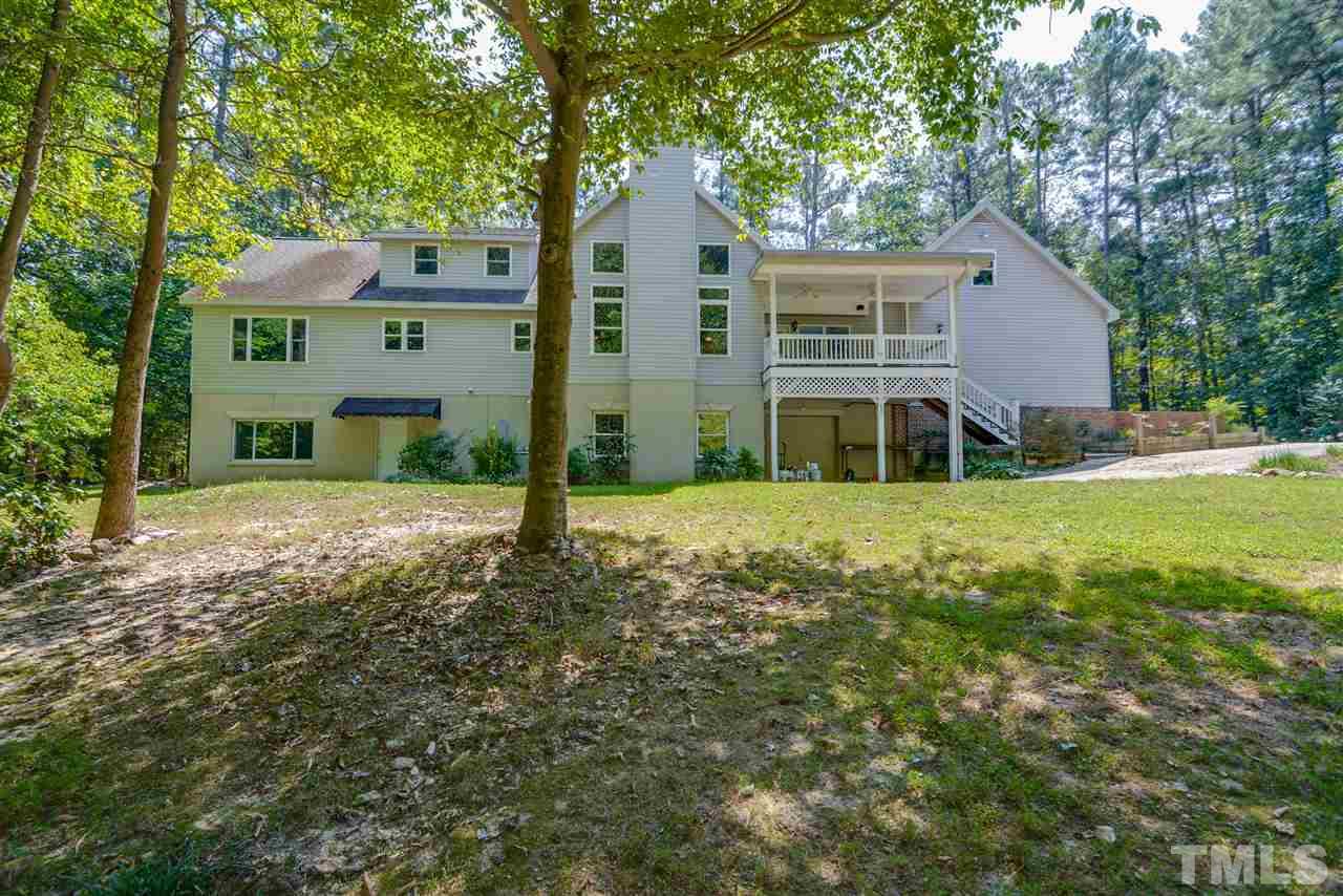 12925 Ghoston Road Wake Forest, NC 27587 - Photo 22 of 24 Basement home!! 4th garage has paved access!! Easy walk from the basement to the front of the house. Vegetable garden area, chicken coop and storage shed.