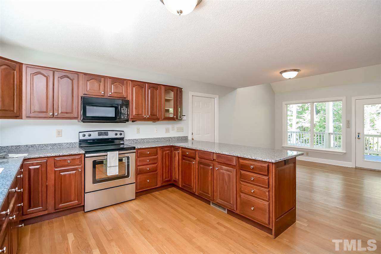 12925 Ghoston Road Wake Forest, NC 27587 - Photo 8 of 24 Kitchen with area for casual dining. Beautiful views of wooded acreage.