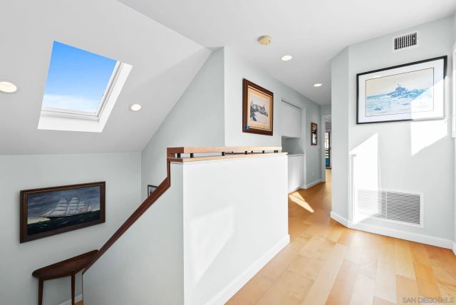 a view of a hallway with a potted plant