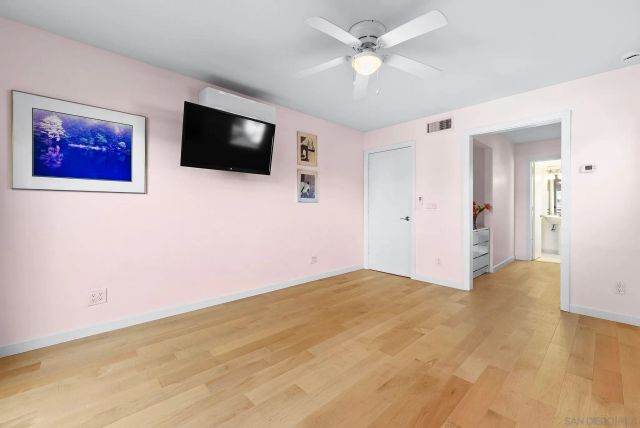 a view of an entryway with wooden floor