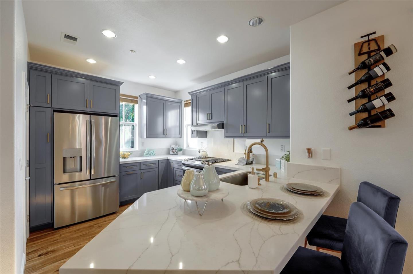 7929 Kipling Circle Gilroy, CA 95020 - Photo 12 of 39 a kitchen with refrigerator and cabinets