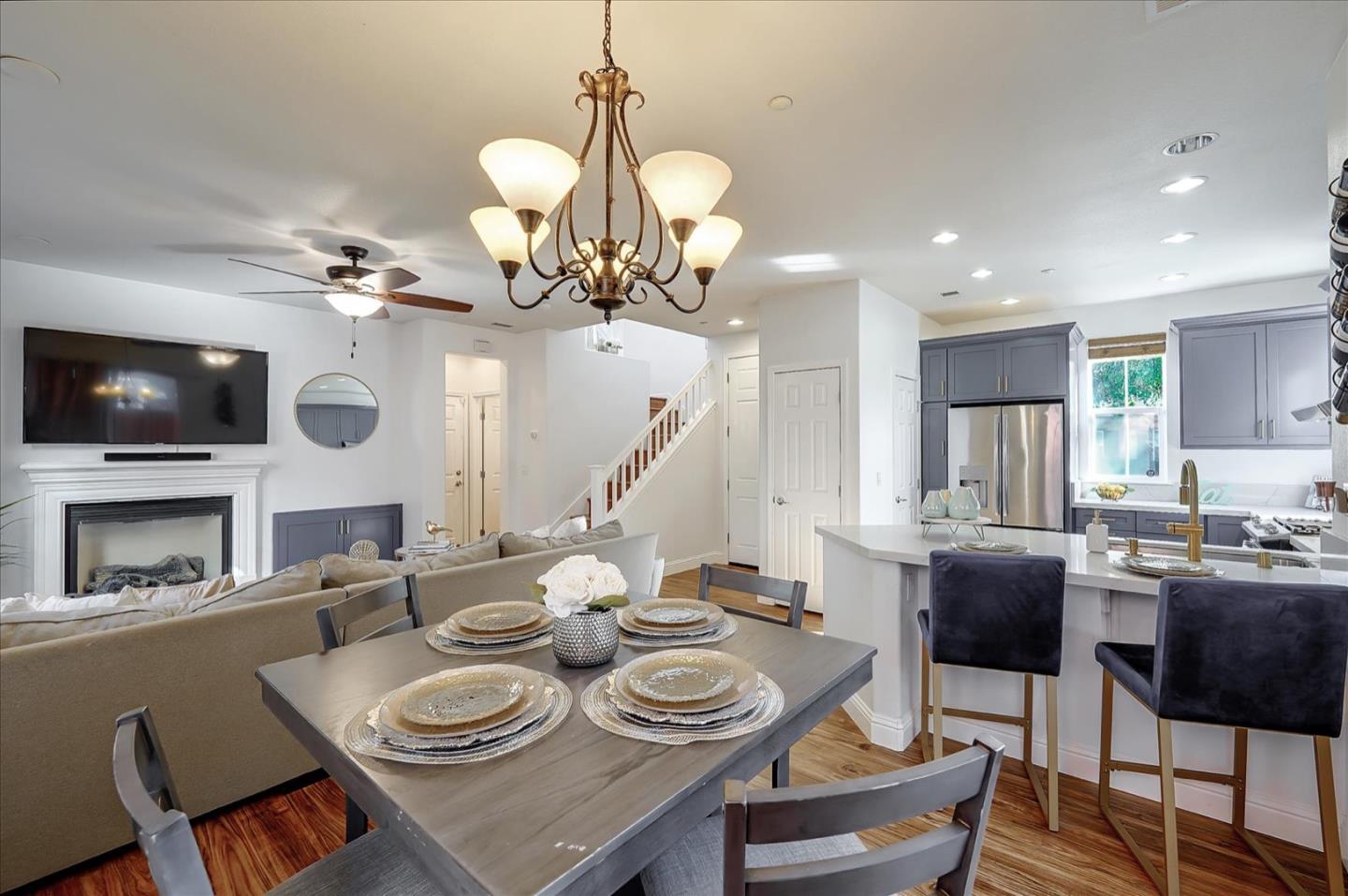 7929 Kipling Circle Gilroy, CA 95020 - Photo 14 of 39 a view of a dining room with furniture a chandelier and wooden floor