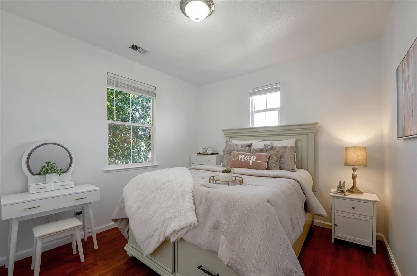 7929 Kipling Circle Gilroy, CA 95020 - Photo 20 of 39 a bedroom with a bed window and a table