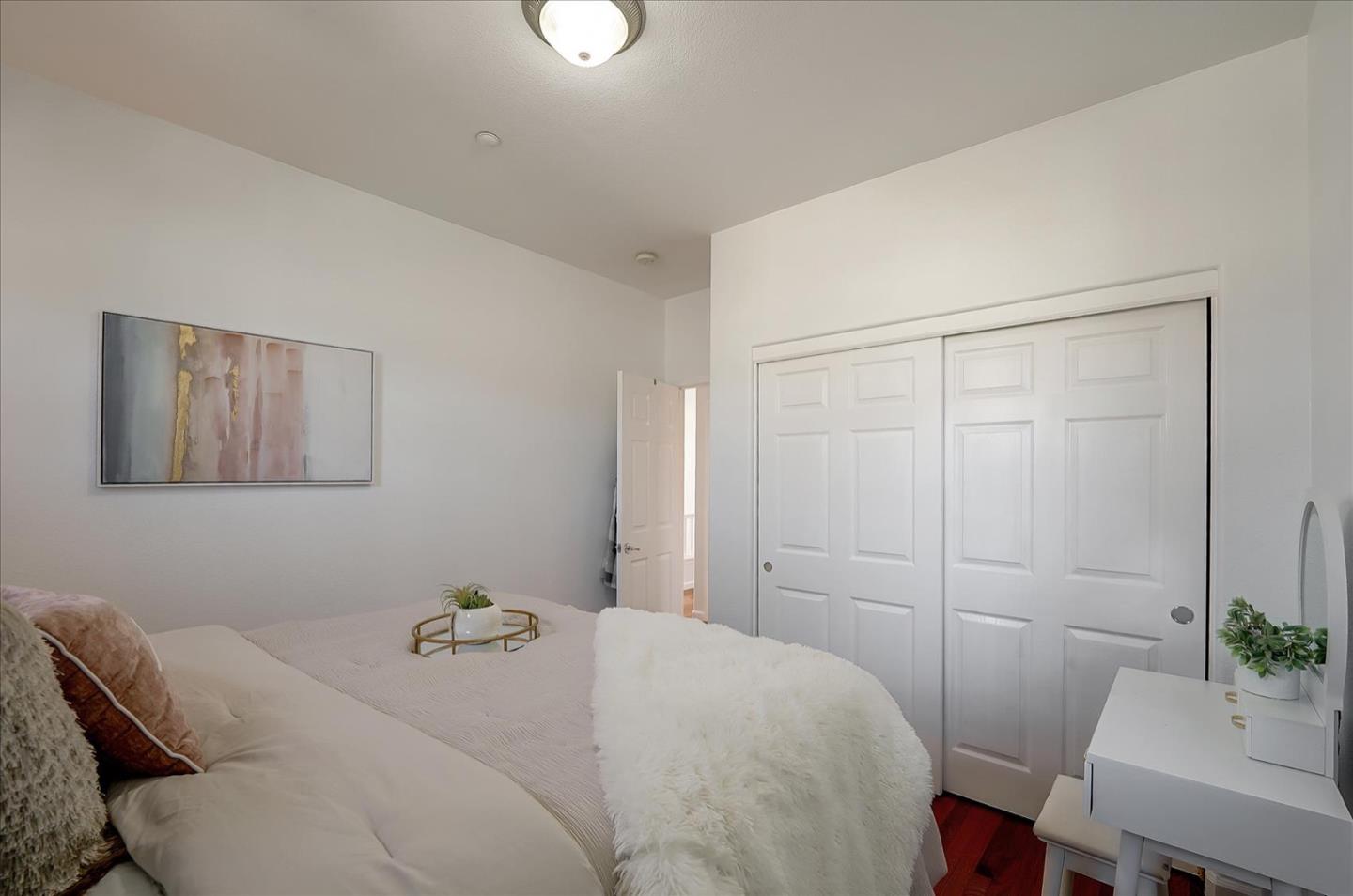 7929 Kipling Circle Gilroy, CA 95020 - Photo 21 of 39 a bedroom with a bed and a table in it