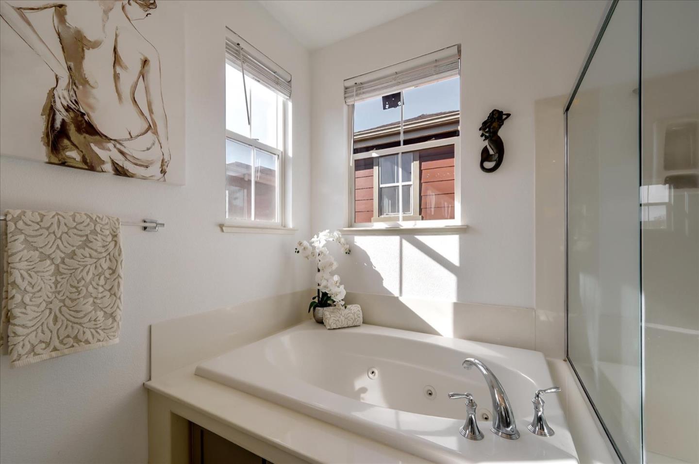 7929 Kipling Circle Gilroy, CA 95020 - Photo 30 of 39 a bathroom with a tub and a window