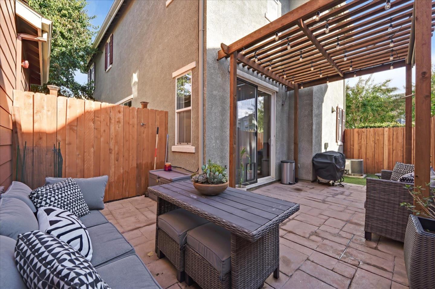 7929 Kipling Circle Gilroy, CA 95020 - Photo 34 of 39 a backyard of a house with fountain table and chairs