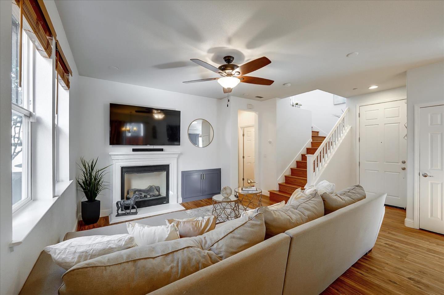 7929 Kipling Circle Gilroy, CA 95020 - Photo 5 of 39 a living room with furniture a flat screen tv and a fireplace