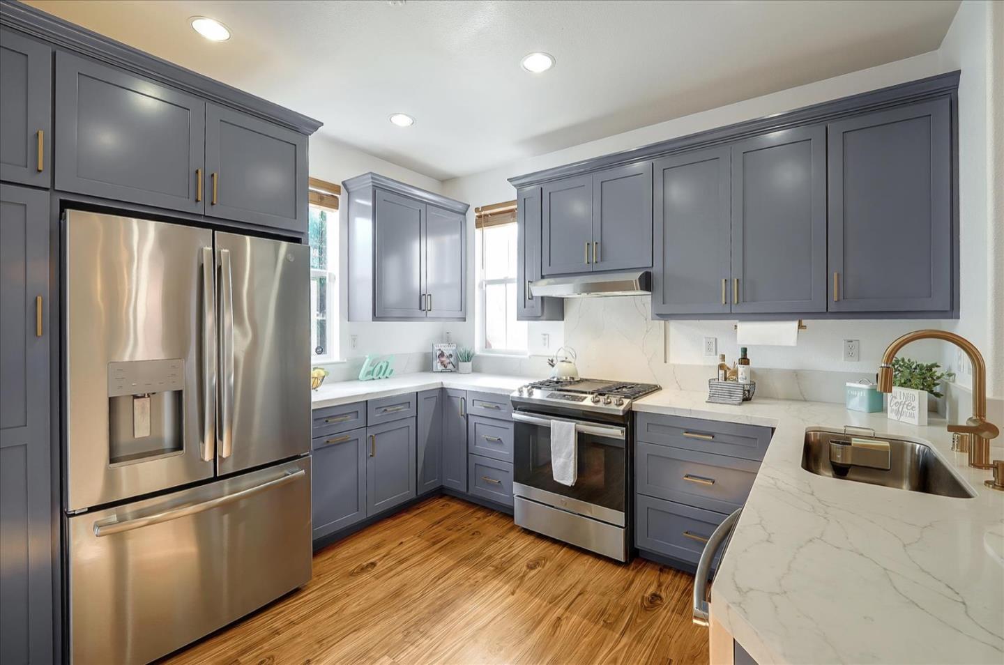 7929 Kipling Circle Gilroy, CA 95020 - Photo 10 of 39 a kitchen with stainless steel appliances granite countertop a refrigerator sink and cabinets
