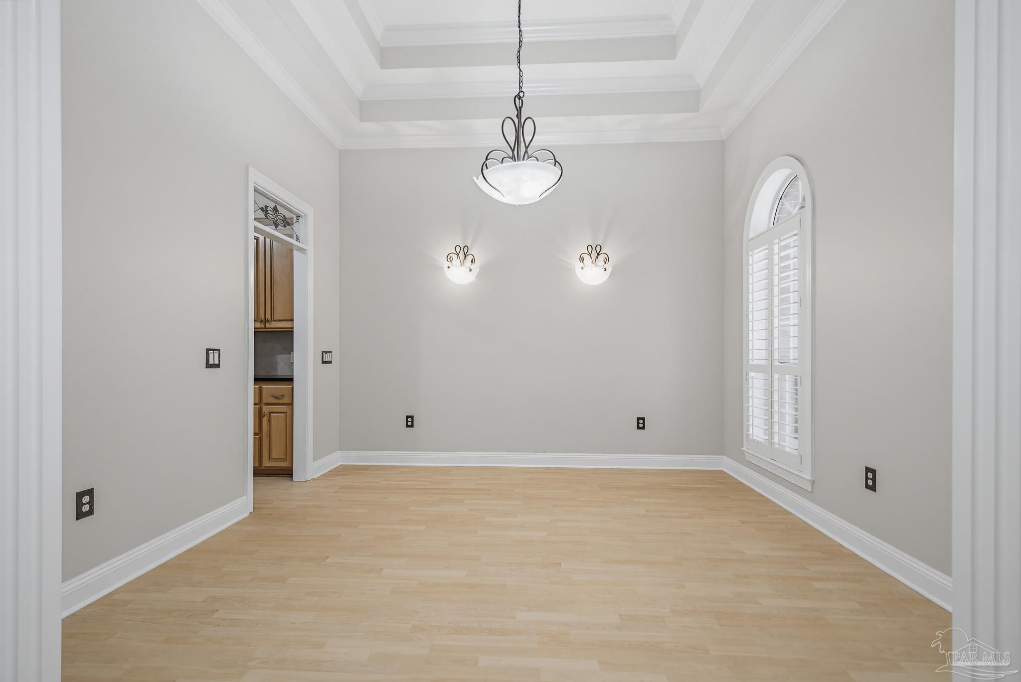2855 Walling Road Milton, FL 32570 - Photo 11 of 55 an empty room with wooden floor and windows