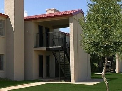 5416 50th Street Lubbock, TX 79414 - Photo 2 of 6 a view of a house with a small yard
