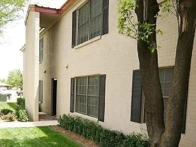 a couple of potted plants in front of door