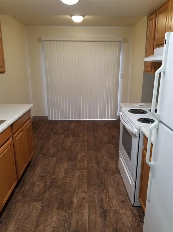 5416 50th Street Lubbock, TX 79414 - Photo 6 of 6 a view of a kitchen with wooden floor and electronic appliances