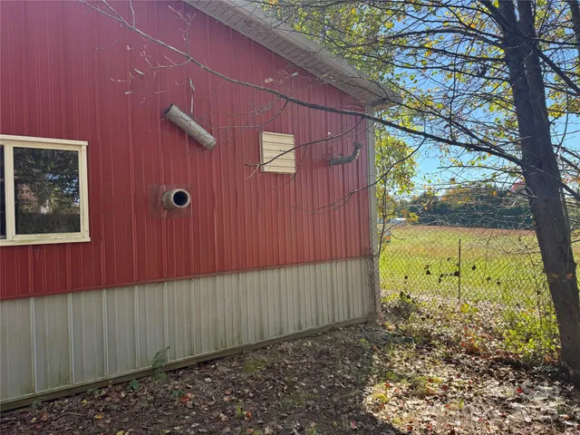 an outdoor view of backyard with tub