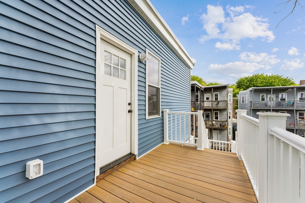 47 Brackett Street, Unit 3 Boston, MA 02135 - Photo 11 of 34 a view of a house with a patio