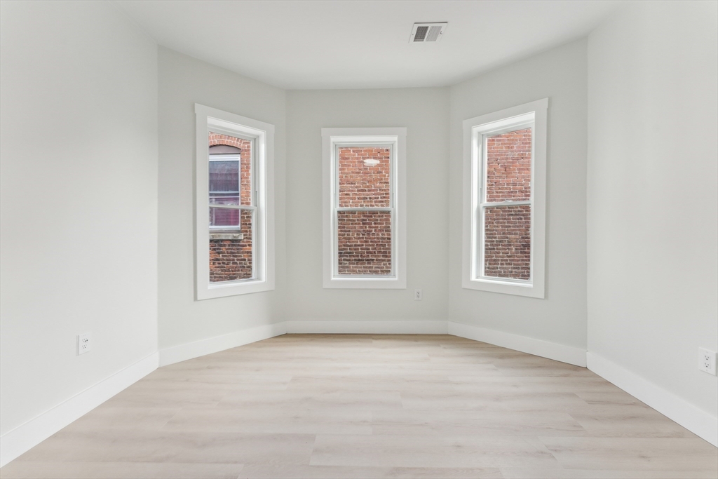 47 Brackett Street, Unit 3 Boston, MA 02135 - Photo 22 of 34 an empty room with a window