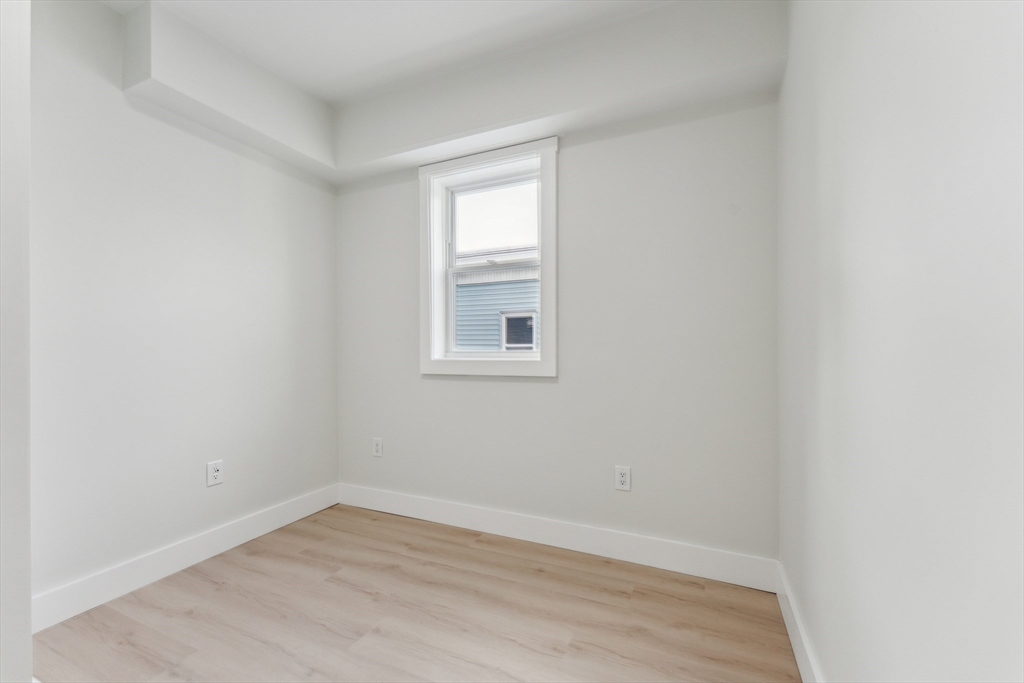 47 Brackett Street, Unit 3 Boston, MA 02135 - Photo 25 of 34 an empty room with a window