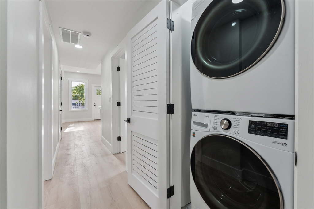 47 Brackett Street, Unit 3 Boston, MA 02135 - Photo 27 of 34 a view of a hallway with washer and dryer