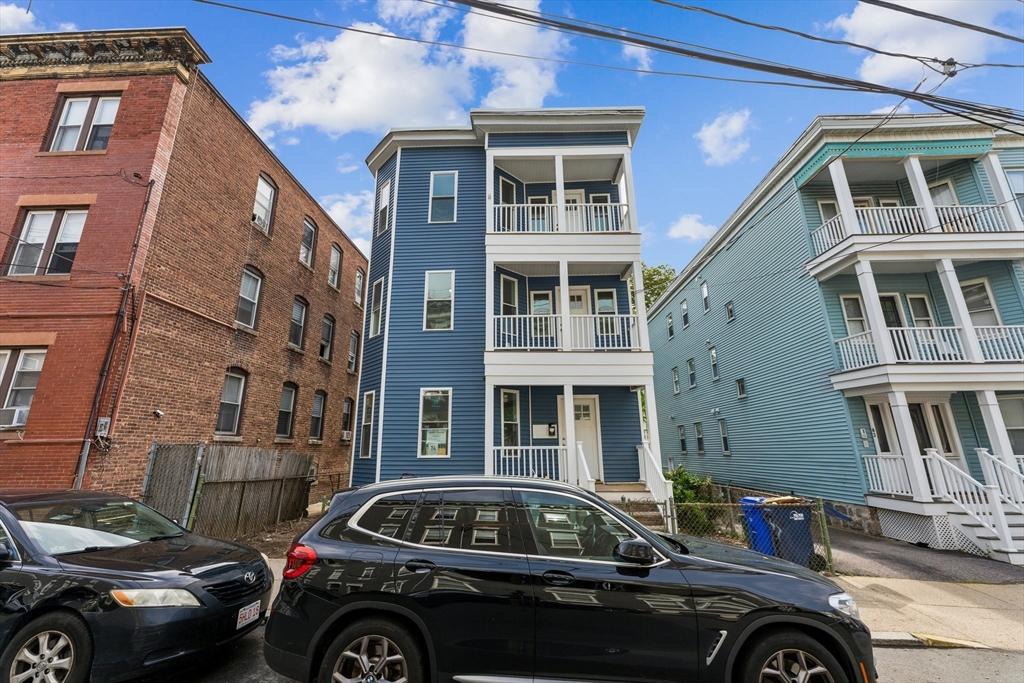 47 Brackett Street, Unit 3 Boston, MA 02135 - Photo 32 of 34 a car parked in front of a building