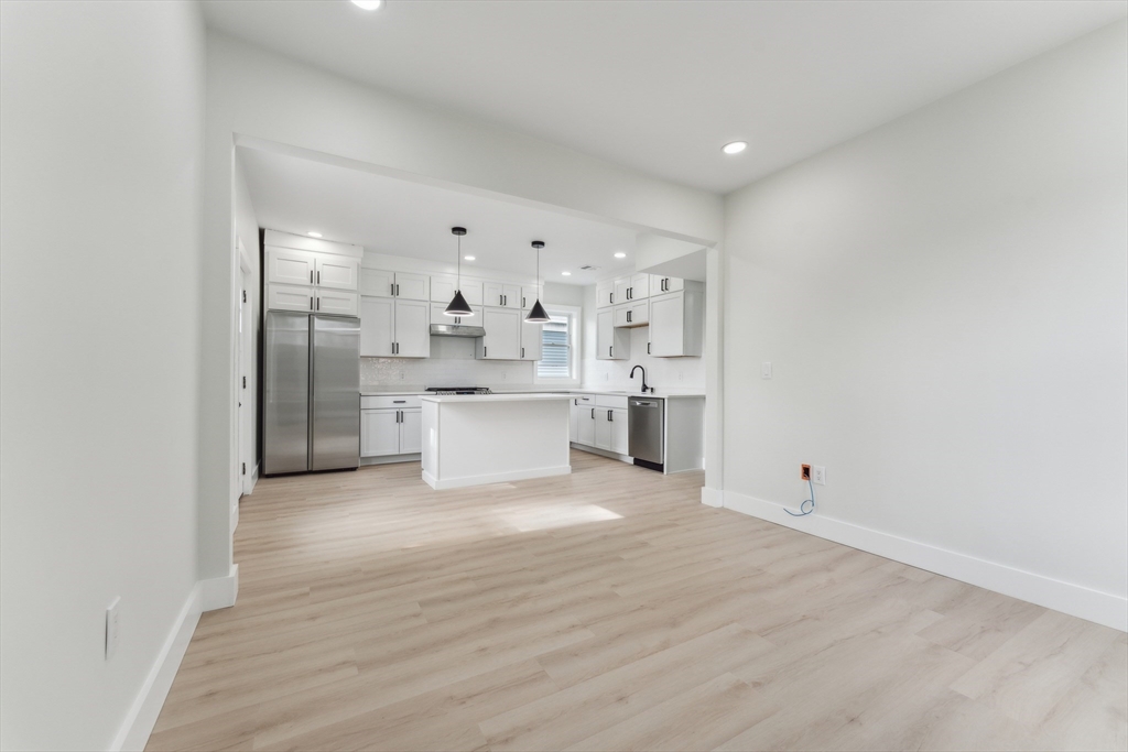 47 Brackett Street, Unit 3 Boston, MA 02135 - Photo 8 of 34 a view of a kitchen with refrigerator and window