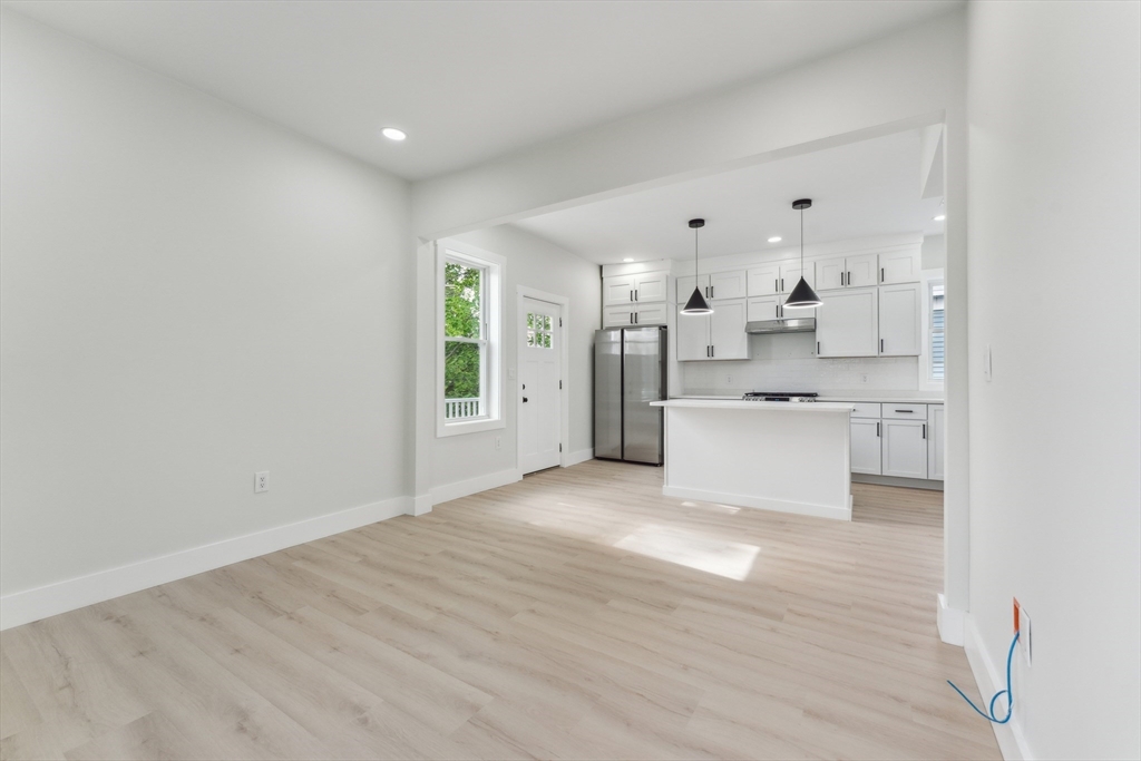 47 Brackett Street, Unit 3 Boston, MA 02135 - Photo 10 of 34 a view of a kitchen with wooden floor