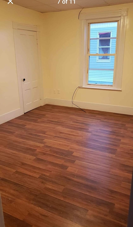 37 Vernon Street Worcester, MA 01610 - Photo 6 of 8 a view of a room with wooden floor and windows