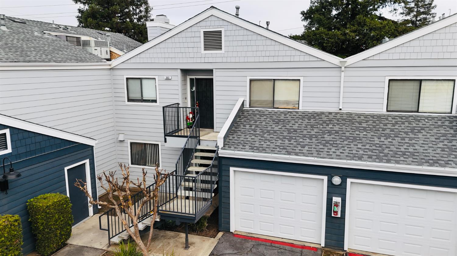 7675 North First Street, Unit 202 Fresno, CA 93720 - Photo 3 of 19 a front view of a house with balcony